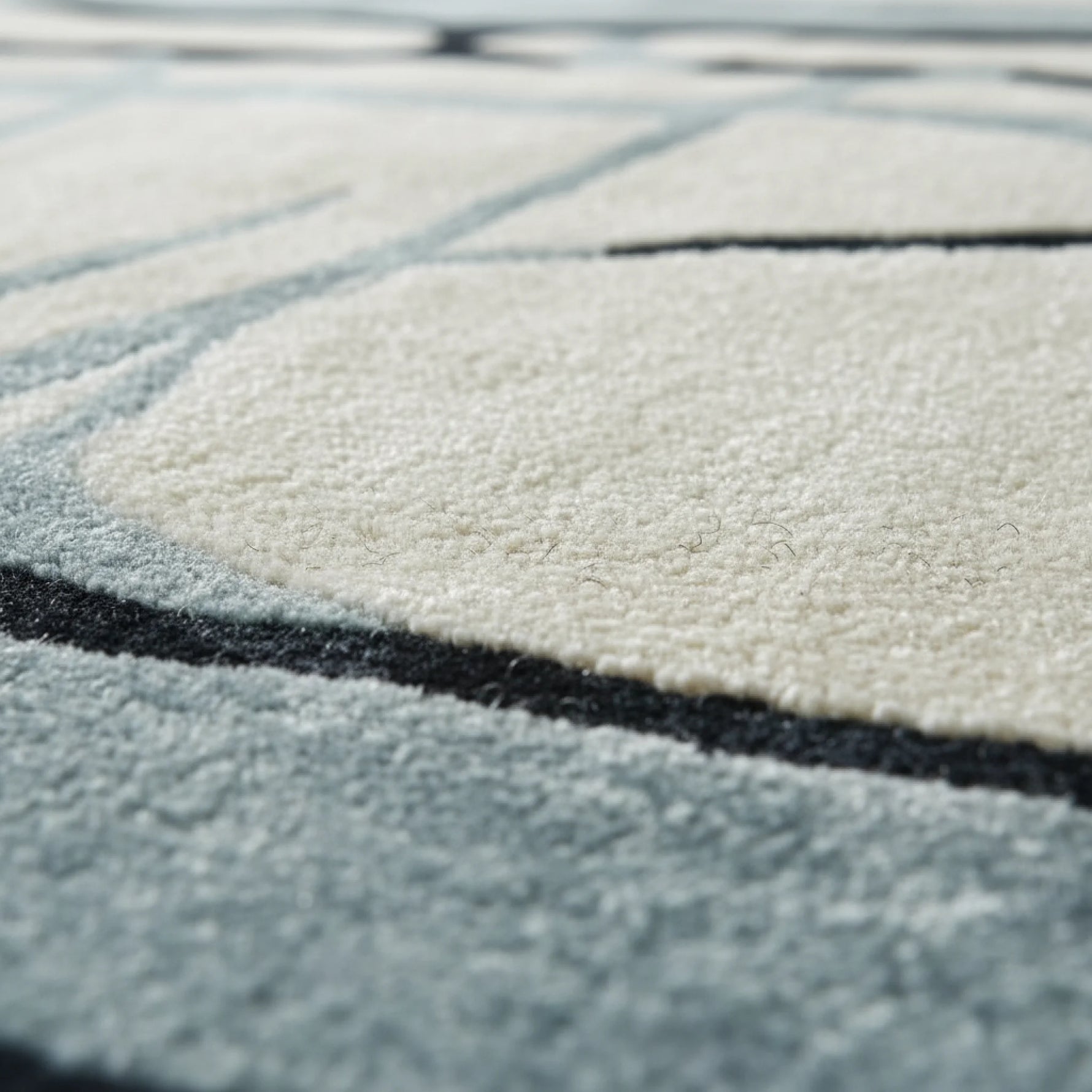 Close-up of a textured rug with geometric pattern