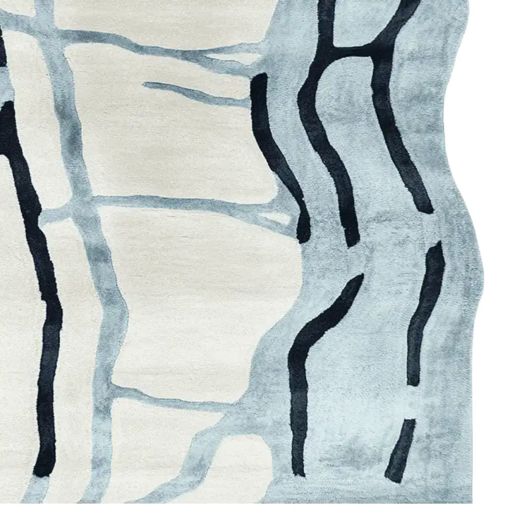Top view of the Drifting Lines Hand Tufted Area Rug showcasing an abstract design with flowing dark lines on a light background. This contemporary wool rug is perfect for large living rooms, adding a modern touch to any space.