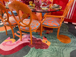 Contemporary Duo Tails Hand Tufted Area Rug in a vibrant dining room setting, featuring abstract lion motifs and colorful patterns, ideal for a stylish bedroom or office space.