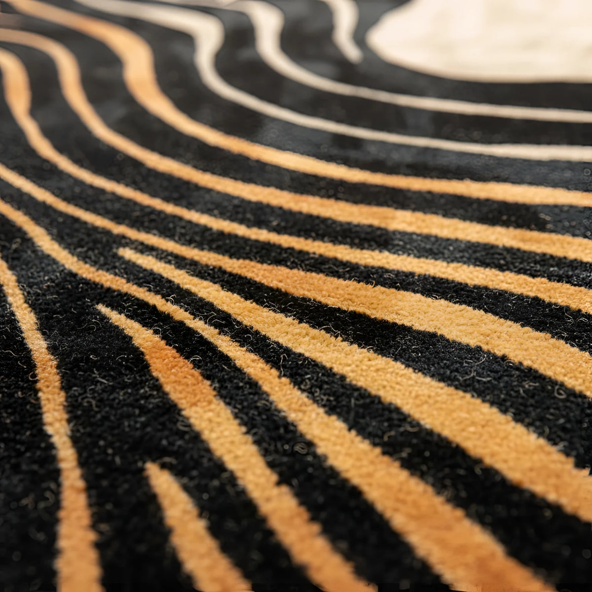 Close-up of a black and gold striped pattern rug
