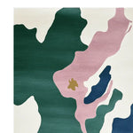 A stylish area rug featuring an abstract design with bold green, pink, and cream tones, perfect for contemporary spaces. This large living room rug is made from high-quality wool, adding a touch of elegance and warmth to your home decor.