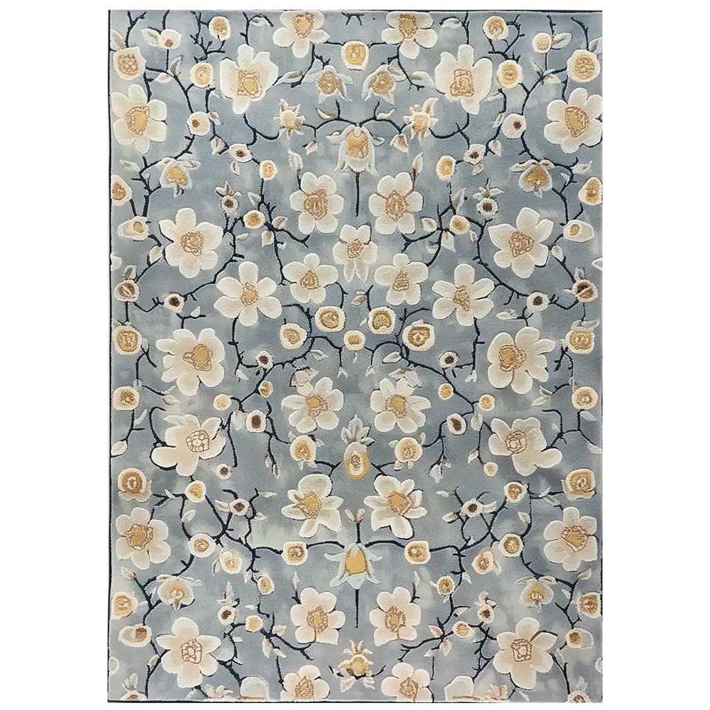 Area rug featuring a serene floral design with cream and beige blossoms set against a soft blue background. The hand-tufted wool rug exudes an Eastern tranquility, perfect for adding a touch of elegance to any room.