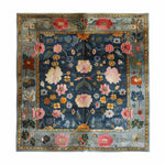 Beautiful area rug with a hand-tufted design, featuring vibrant floral patterns in rich colors. This large Persian-inspired wool rug is perfect for adding elegance to a living room. The intricate details make it a standout choice for those seeking large area rugs for living room spaces.