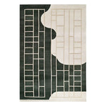 Ebony Lattice Dream Knotted Wool Rug featuring a striking abstract design with contrasting black and white sections, showcasing an intricate grid pattern. This area rug adds a modern touch to any room, combining elegance and style.