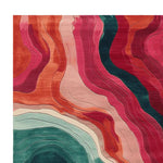Vibrant Echoes of Color Hand Tufted Area Rug featuring abstract, flowing patterns in bold shades of red, orange, pink, and teal. This contemporary rug is perfect for adding a pop of color to area rugs for living room spaces. Made from high-quality wool, this living room area rug combines style and comfort seamlessly.