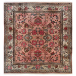 Top view of an Echoes of Eden Knotted Wool Area Rug featuring intricate floral patterns in shades of red, pink, and gray on a warm beige background. The elegant border highlights traditional motifs, adding a touch of classic sophistication to any room.