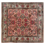 Top view of the Echoes of Eden Knotted Wool Rug showcasing an intricate floral pattern with vibrant red and earthy tones on a soft background. This area rug adds elegance and warmth to any room.