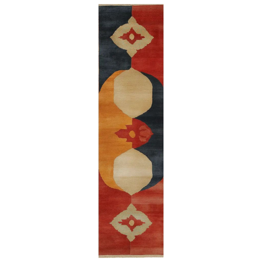 The Echoes of Eternity Knotted Wool Rug showcases a vibrant and abstract design with bold geometric shapes in red, orange, and dark hues. This area rug, perfect for adding a touch of elegance and warmth, features intricate patterns that create a striking visual impact, ideal for contemporary and modern spaces.