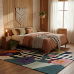 Bedroom with a colorful rug, bed, and decorative elements.
