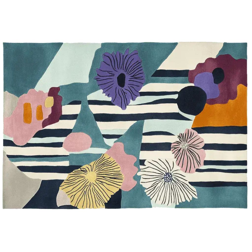 A vibrant Eclectic Bloom Hand Tufted Area Rug featuring colorful abstract floral patterns. This contemporary wool rug is perfect for adding a splash of color to large living room spaces, showcasing shades of purple, orange, pink, and blue against a striped background.