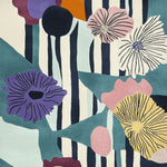 Vibrant Eclectic Bloom Hand Tufted Area Rug featuring bold floral patterns and abstract stripes, perfect for contemporary living rooms. This large wool rug adds a splash of color and style, ideal for those seeking unique rugs for their living room.
