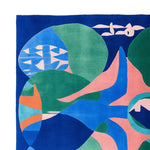 This vibrant hand-tufted wool area rug features an eclectic abstract design with bold shapes and colors, perfect for a contemporary living room. The square rug showcases a mix of blues, greens, and pinks, adding a splash of artistic flair to your space.