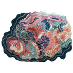 Eclectic Garden Hand Tufted Wool Rug featuring a vibrant abstract floral design in shades of pink, blue, green, and orange. The area rug showcases intricate patterns and textures, creating a lively and artistic appearance.