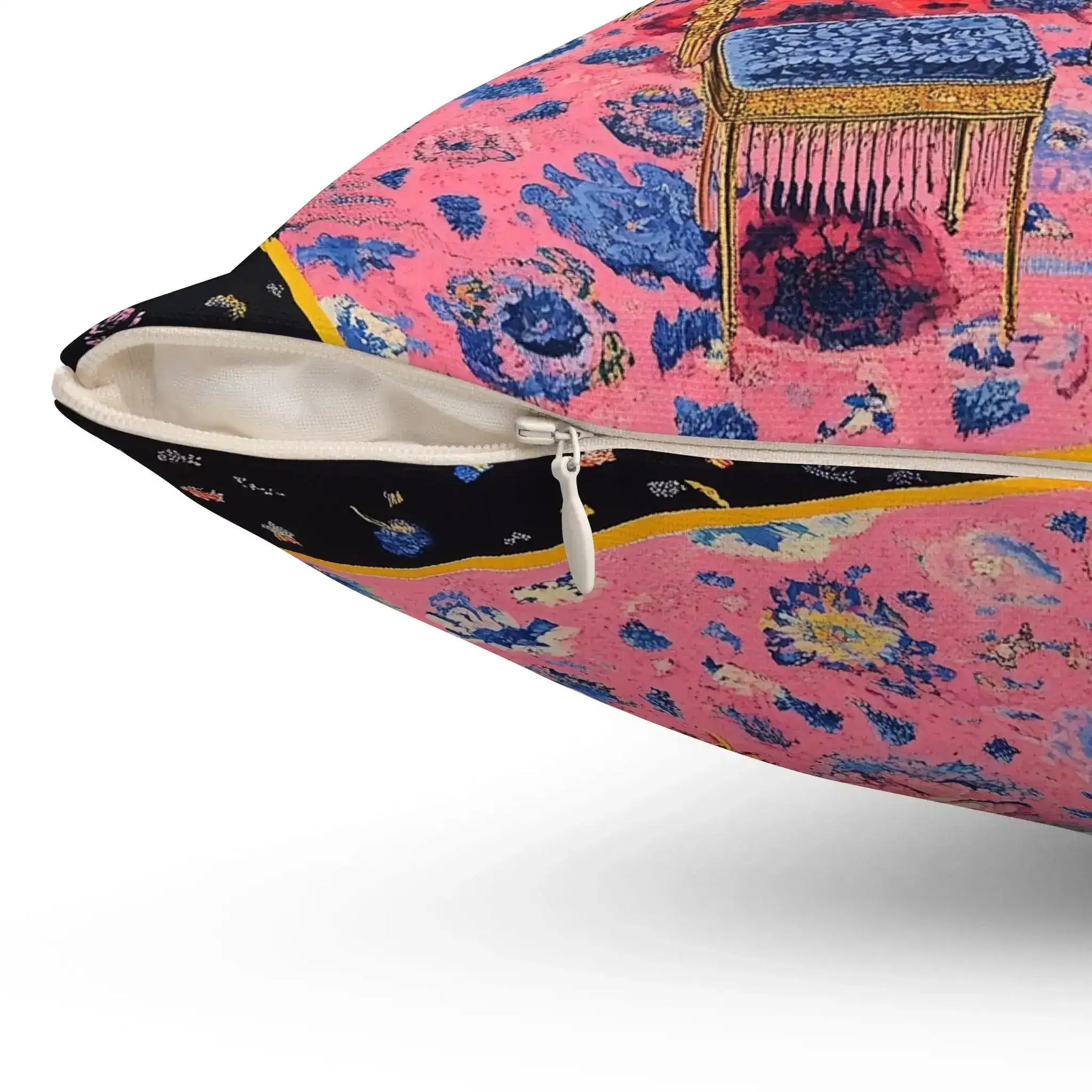 Close-up corner showing white zipper, pink floral carpet and gold fringe table on the Eclectic Maximalist Decorative Pillow detail