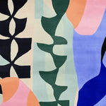 This vibrant area rug showcases a contemporary design with bold abstract shapes in colors like green, blue, pink, and orange. Ideal for a large living room, this square wool rug adds a touch of modern artistry to any space.