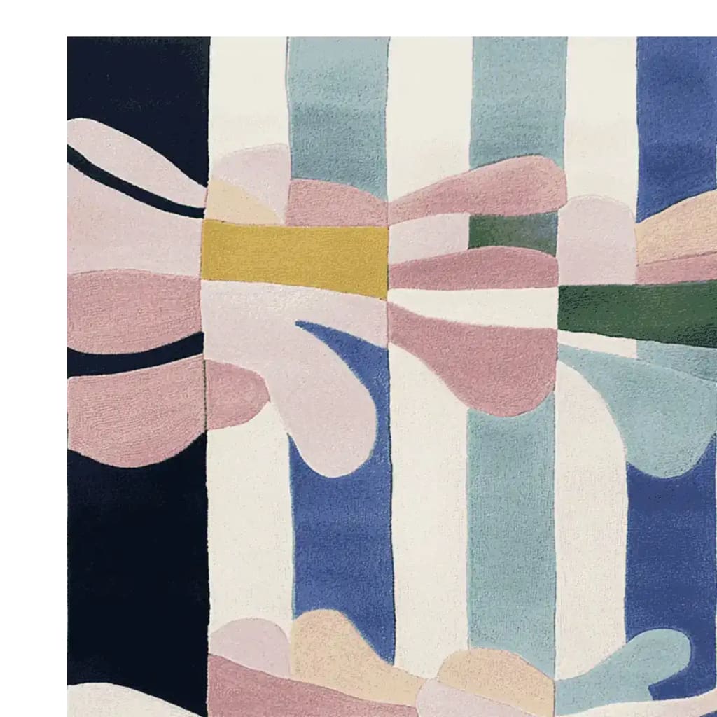 A vibrant, hand-tufted area rug featuring an abstract design with bold stripes in blue, pink, and white, ideal for contemporary rugs for living rooms. This 8x10 wool rug adds a modern touch to any space.