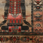 A close-up view of the Egyptian Enigma Wool Hand Knotted Area Rug, featuring intricate vintage patterns with rich colors. Perfect for adding a touch of elegance to living room spaces, this rug blends traditional design with modern aesthetics, ideal for those seeking unique living room area rugs.