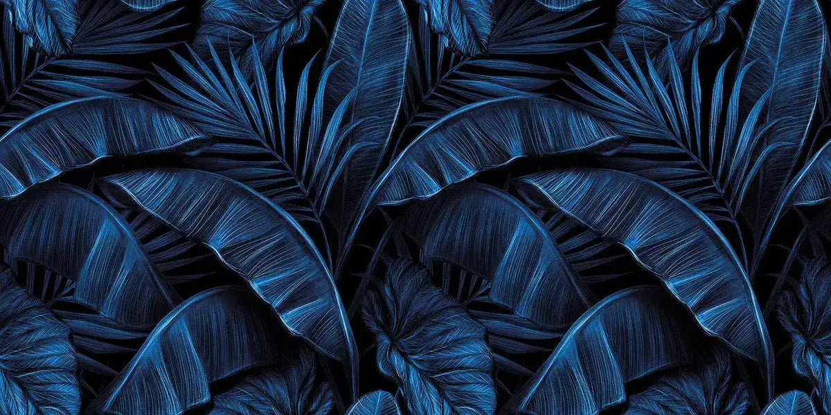 Electric blue tropical wallpaper with overlapping banana leaves and palm fronds in deep indigo tones
