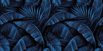 Electric blue tropical wallpaper with overlapping banana leaves and palm fronds in deep indigo tones