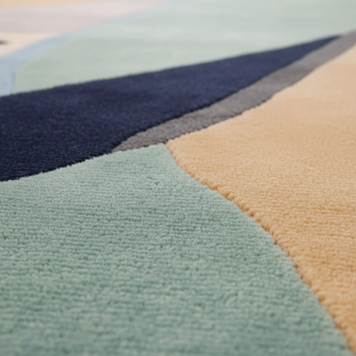 Close-up of a multicolored geometric-patterned rug.