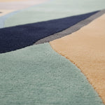 Close-up of a multicolored geometric-patterned rug.
