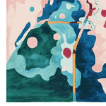 A vibrant Electric Land Pulse Hand Tufted Rug featuring abstract patterns in shades of blue, green, pink, and yellow. This contemporary wool area rug is perfect for adding a splash of color to any living room, making it an ideal choice for those seeking stylish area rugs for their home decor.