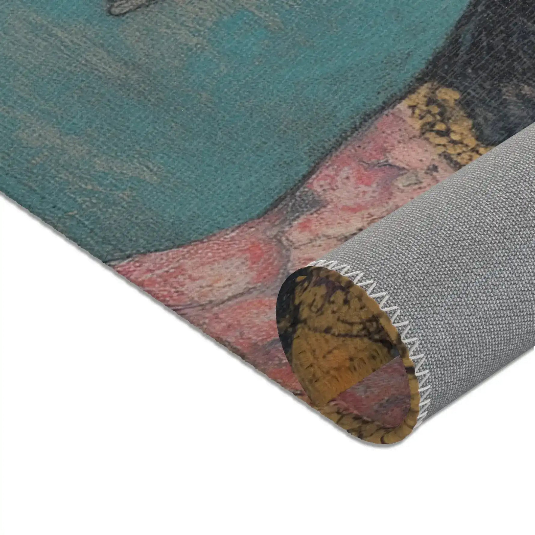 Rolled edge of Elegance in Flight Couture Butterfly Accent Rug showing teal face fabric pink floral detail and grey backing seam