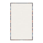 Kitchen towel corner showing swirling black ivory abstract line texture with grey non-slip backing edge visible