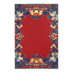 Angled flat lay of Elegant Chinoiserie Red & Blue Accent Rug with red field and blue gold scrollwork border pattern