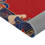 Close-up corner of Elegant Chinoiserie Red & Blue Accent Rug folded to show blue gold border detail and gray non-slip backing