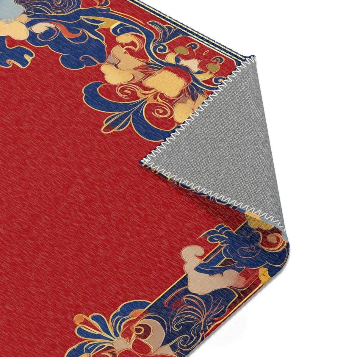 Diagonal corner fold of Elegant Chinoiserie Red & Blue Accent Rug revealing red field blue gold ornate border and gray backing