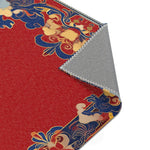 Diagonal corner fold of Elegant Chinoiserie Red & Blue Accent Rug revealing red field blue gold ornate border and gray backing