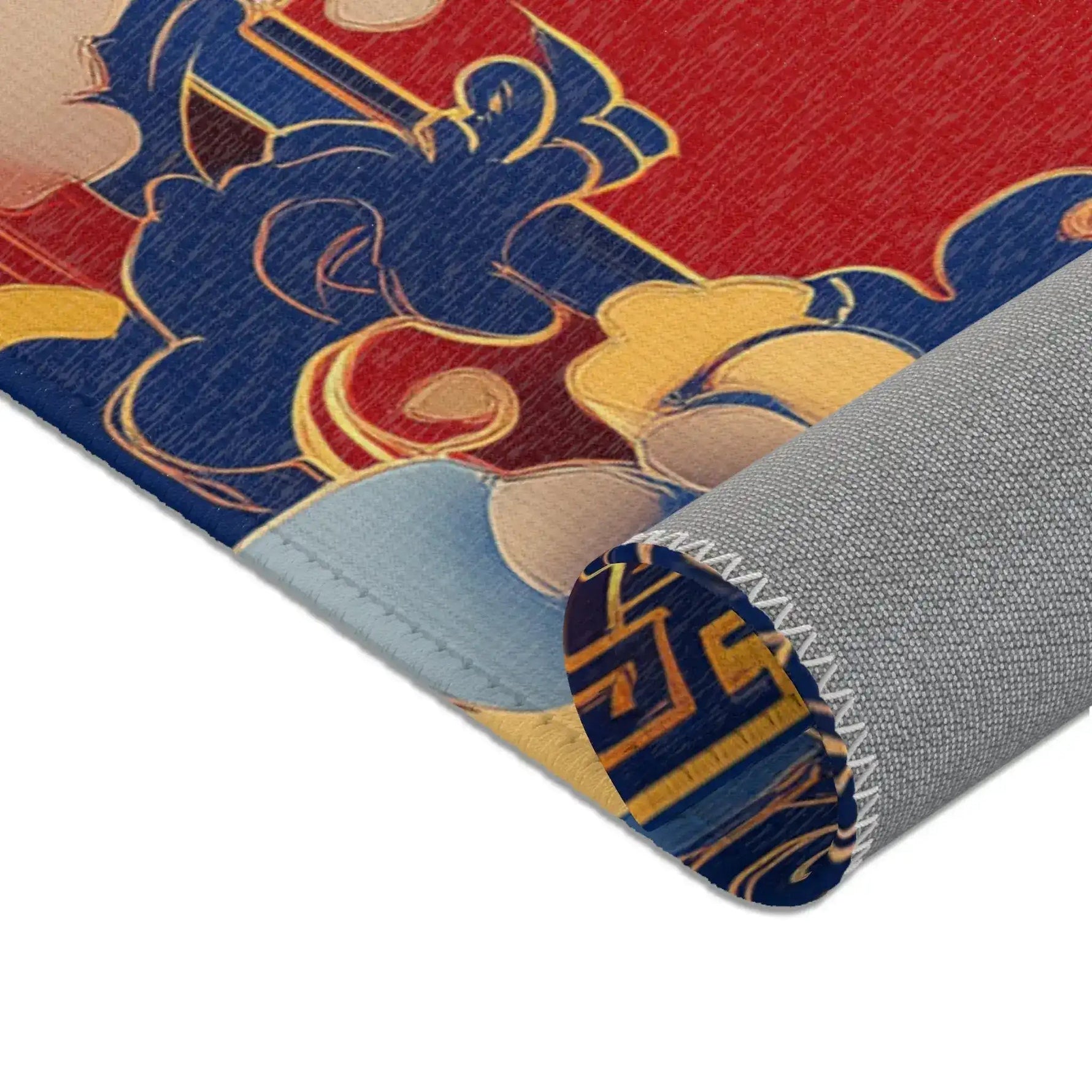 Rolled corner of Elegant Chinoiserie Red & Blue Accent Rug showing blue gold floral border and gray backing