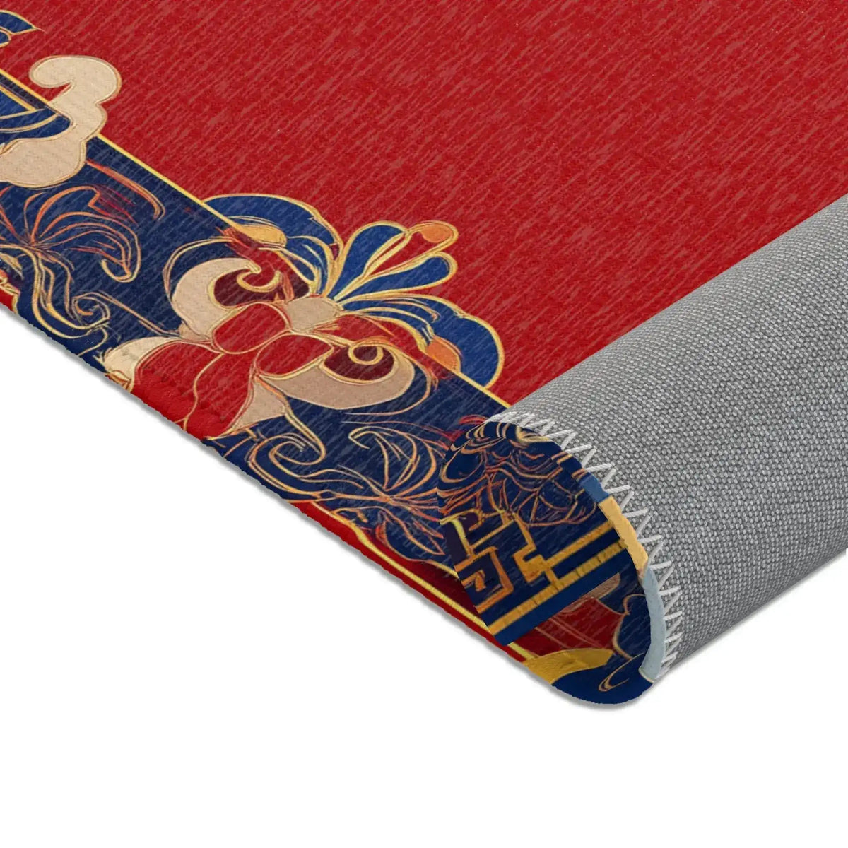 Corner fold detail of Elegant Chinoiserie Red & Blue Accent Rug showing surrealist portrait art and gray non-slip backing