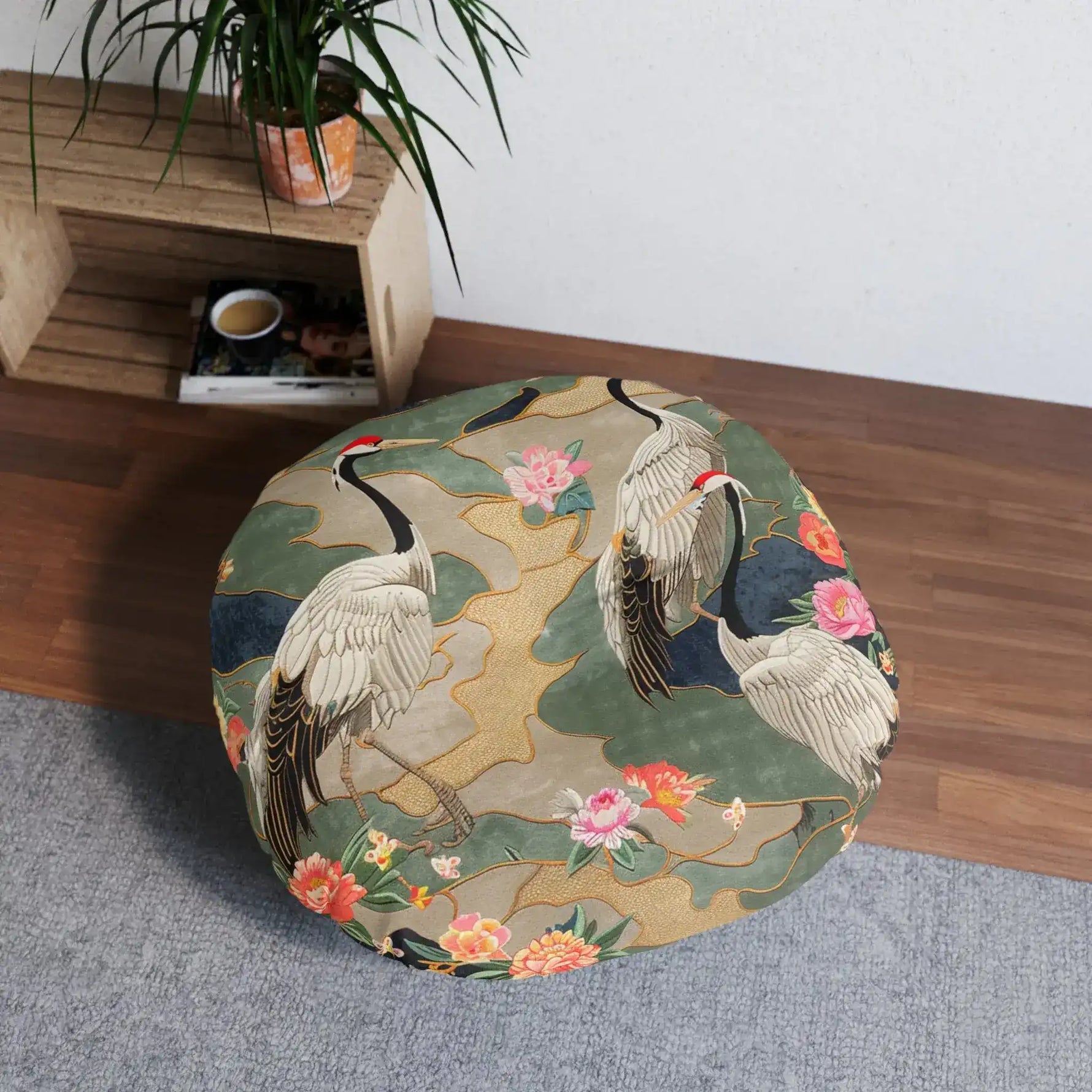 Elegant Crane and Floral Pattern Floor Pillow styled in a room broader crop showing fuller floral detail on shelf background