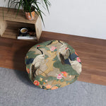 Elegant Crane and Floral Pattern Floor Pillow styled in a room with wooden shelving unit and green plant behind it