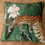 Elegant green leopard-print throw pillow cover featuring a detailed leopard design against a lush background of leaves and flowers.