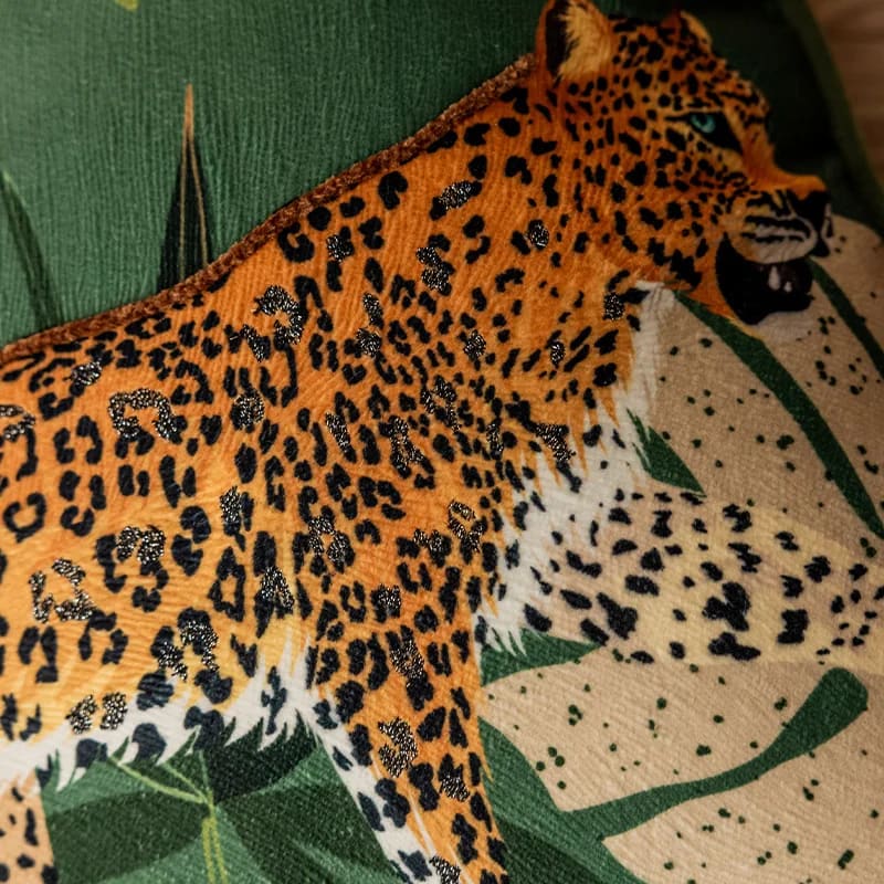 Elegant green leopard-print throw pillow featuring a striking leopard design and lush foliage, perfect for adding a touch of exotic flair to any decor.