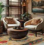 Elegant living room featuring a Botanical Grace Wool Hand Knotted Area Rug with a vintage floral design. This large 8x10 Persian-style rug adds a touch of sophistication to the space, complementing the cozy armchairs and round wooden coffee table.