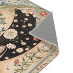 Elegant Woman and Floral Art Rug folded corner detail on dark field with scattered white floral dot pattern and ornate cream botanical border