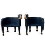 Pair of hand crafted wooden elephant Maharaja chairs in dark navy with gold anklets and carved elephant head backs, front view.