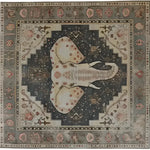 Top view of the Elephant Whisper Hand Tufted Rug, a large area rug featuring an intricate elephant design in the center, surrounded by ornate patterns in earthy tones. Perfect for adding a touch of elegance to living rooms, this wool rug combines style and comfort, making it an ideal choice for those seeking large area rugs for living room spaces.