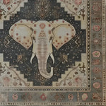Stunning Elephant Whisper Hand Tufted Area Rug featuring a majestic elephant design at the center, crafted with rich wool. This large area rug is perfect for a living room, combining elegance and functionality. The intricate patterns and earthy tones create a warm and inviting atmosphere, making it an ideal choice for large area rugs in the living room.