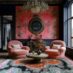 Stylish living room featuring the Ember Crest Hand Tufted Area Rug with an abstract design in vibrant colors, complementing the plush pink chairs and ornate wall decor. This contemporary wool rug adds a touch of elegance to the space, perfect for those seeking rugs for living room or living room area rugs.