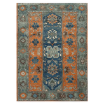 The Ember Haven Hand Tufted Area Rug features a captivating vintage design with rich orange and blue hues, perfect for large living rooms. This wool rug showcases intricate floral patterns, offering both style and comfort.