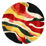 A vibrant round area rug featuring an abstract design with flowing waves of red, yellow, green, and black. Perfect for adding a contemporary touch to large living rooms, this hand-tufted wool rug combines modern aesthetics with comfort, making it an ideal choice for those seeking stylish rugs for living room spaces.