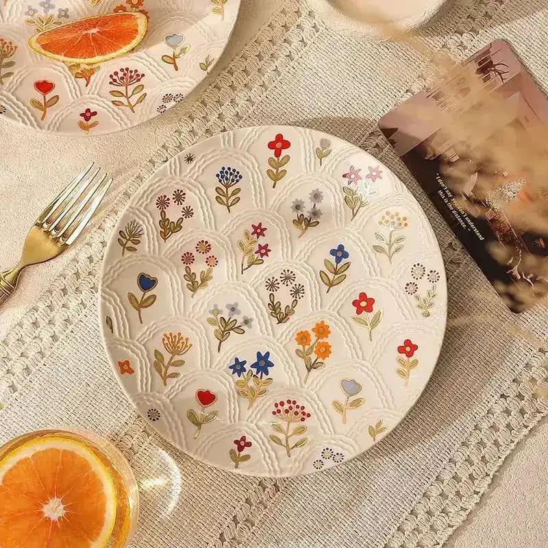 Embossed Shell Floral Plate is a decorative item or serving dish that combines elegant floral motifs with the natural beauty of shell patterns. Its surface is typically adorned with raised (embossed) designs that give it a textured, three-dimensional appearance