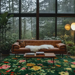 A vibrant Emerald Oasis hand tufted area rug featuring lush floral patterns in a cozy living room setting. The wool rug's rich green base is adorned with colorful flowers, enhancing the warm ambiance created by the brown leather sofa and large windows overlooking a serene forest. Ideal for both living room and dining room spaces, this exquisite piece adds a touch of nature-inspired elegance to your home decor.