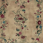 The Empire Blossom Hand Knotted Rug showcases an elegant floral design in rich hues on a beige background, perfect as an area rug for living room spaces. This exquisite wool rug adds a touch of sophistication and warmth, making it an ideal choice for those seeking living room area rugs with a floral motif.