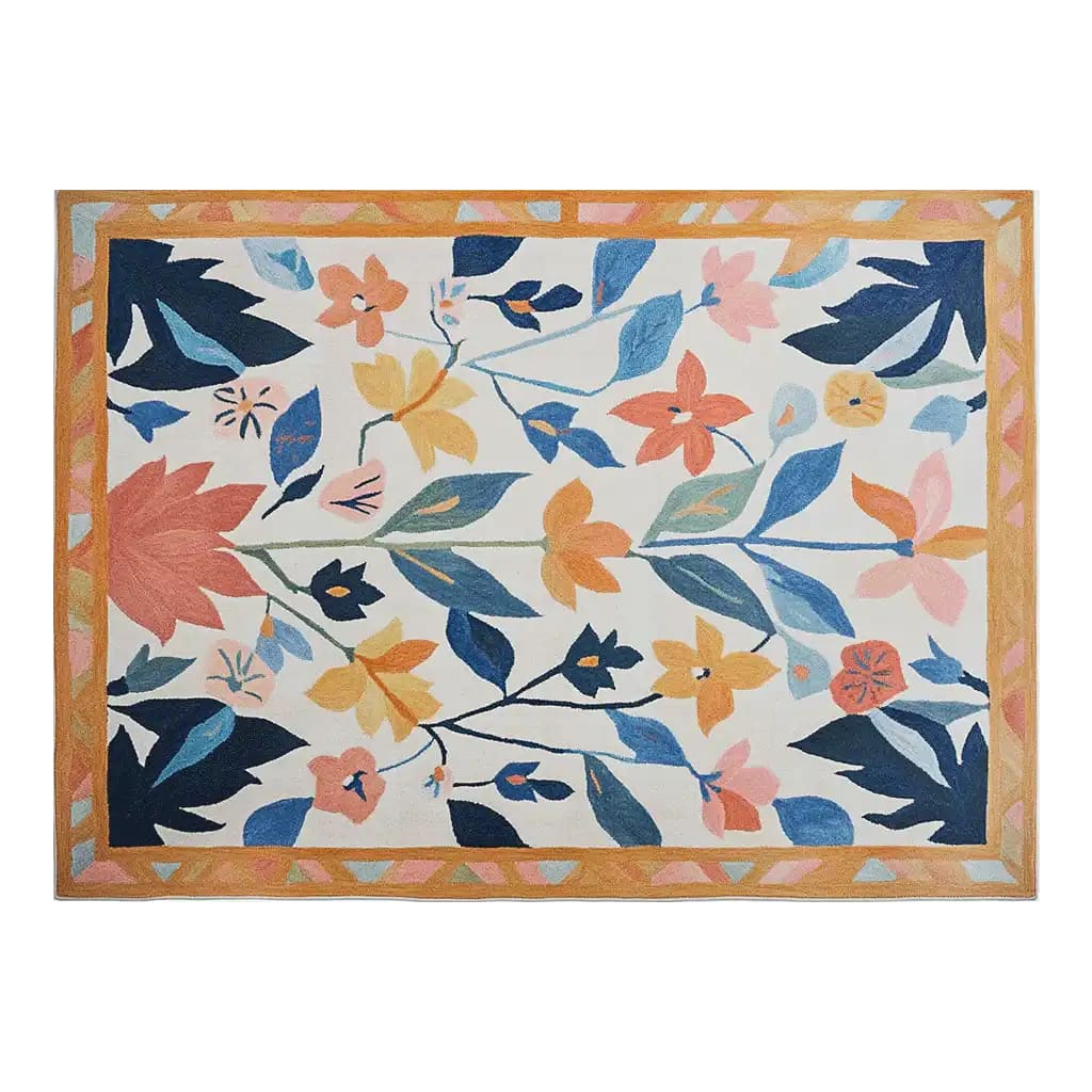 Top view of the Enchanted Blossom Hand Tufted Wool Area Rug featuring a vibrant floral design with colorful leaves and flowers in shades of blue, orange, and pink. The rug's border is decorated with a warm geometric pattern, enhancing its enchanting appeal.